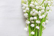 Lily of the valley flowers on wood