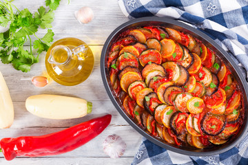 Poster - Layered ratatouille in a baking dish, top view