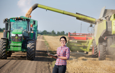 Wall Mural - Girl at wheat harvest