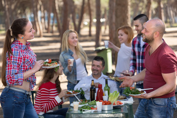 Happy friends making grill .