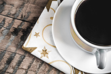 Coffee Mug on a wooden table with a white cloth. Working environment. Rest.