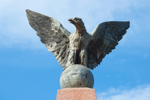 The Sculpture Of An Eagle Close Up. The Top Of The Monument To The Soldiers Of The Regiment Villastrada Died In The Russo-Japanese War. Staraya Russa