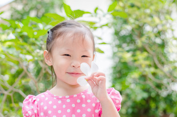 Wall Mural - Cute little asian girl in garden on summer time