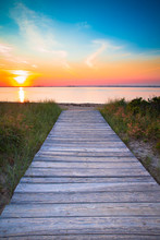 Wooden Beach Path To Sand And Sea At Sunset