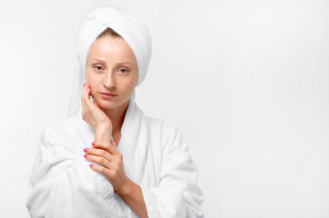 Wall Mural - Beauty portrait of woman wearing a towel and white bathrobe