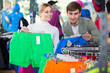 © JackF - Couple trying items in the sport shop.