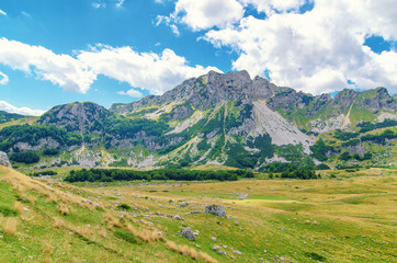 Wall Mural - Montenegro, national park Durmitor, mountains and clouds. Sunlight lanscape.