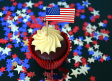 Happy Independence Day, Celebration, Patriotism And Holidays Concept - Close Up Of Glazed Cupcakes Or Muffins Decorated With American Flags At 4th July Party