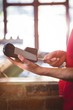 © WavebreakMediaMicro - Waiter inserting customer's credit card into credit card machine