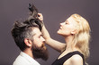 © Volodymyr - blonde hairdresser combing bearded man