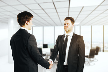 Sticker - attractive businessmen shaking hands