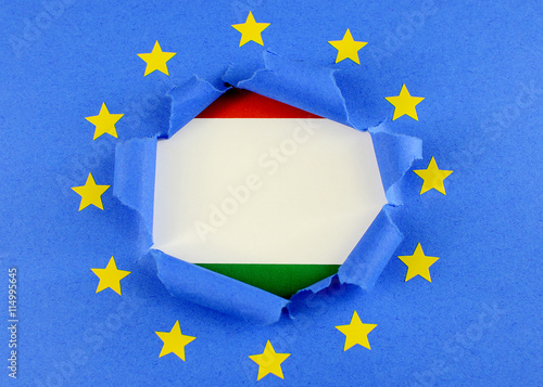 The Red White And Green Flag Of Hungary Is Behind The Torn Open