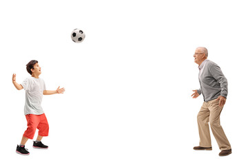 Poster - Kid playing soccer with his grandfather