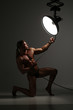 © kazanovskyiphoto - Young naked man, sexy strong muscular body with studio lighting