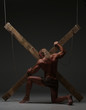© kazanovskyiphoto - Sexual naked man, muscular, hands tied rope to wooden beams