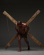 © kazanovskyiphoto - Sexual naked man, muscular, hands tied rope to wooden beams