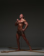 © kazanovskyiphoto - Screaming naked muscular man, hands tied rope to wooden beams