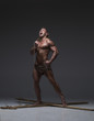 © kazanovskyiphoto - Screaming naked muscular man, hands tied rope to wooden beams