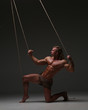 © kazanovskyiphoto - Young naked man, muscular body, bounded with rope