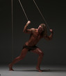 © kazanovskyiphoto - Young naked man, muscular body, bounded with rope