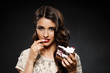 © Cookie Studio - Picture of sexy woman in creamy dress holding piece of cake