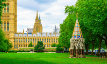 Palace Of Westminster And Buxton Memorial Fountain In Victoria Tower Gardens In London