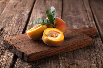 Wall Mural - Ripe peaches with leaves