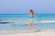 © godfer - woman running on beach