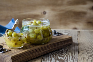 Sticker - Homemade organic berry jam in glass jar on rustic wooden table