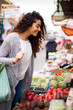 © michael spring - young woman shopping at the market