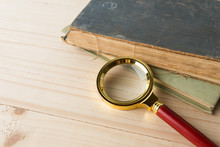 Magnifying Glass And Book