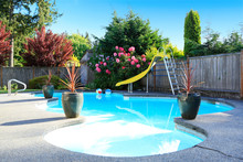 Fenced Backyard With Small Beautiful Swimming Pool
