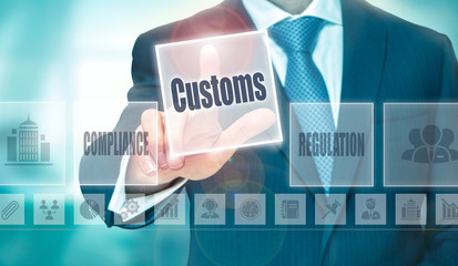 A businessman selecting a Customs Concept button on a clear screen.