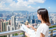 Young Woman travel in Hong Kong city with city map