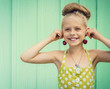 Beautiful girl holding cherries as earrings -style Rockabilly.