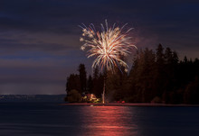 4th Of July Fireworks Display.Independence Day Signals Fireworks And Beach BBQ. Here The Celebrations Take Place At Agate Pass Between Bainbridge Island And The Olympic Peninsula, Washington State.