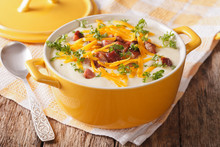 Delicious Cream Potato Soup With Bacon And Cheddar Cheese Close-up. Horizontal
