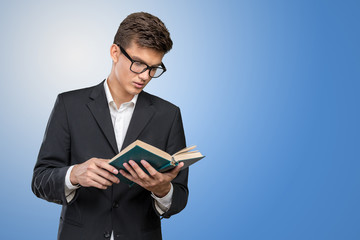 Handsome young business man with a book