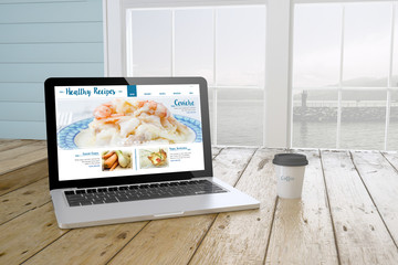Wall Mural - laptop with healthy recipes website on screen with port backgrou