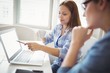 © WavebreakMediaMicro - Businesswoman pointing on laptop with colleague in office