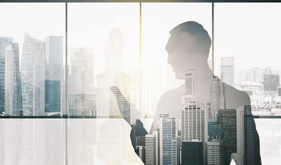 silhouette of businessman with smartphone