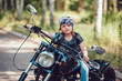 © kanashkin - Little girl on a motorcycle.
