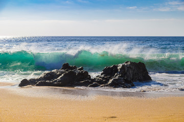 Huge ocean waves crushing on rocks in Garrapata State Beach in California, USA