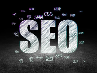 Web development concept: SEO in grunge dark room