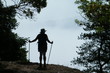 © Roxanne Haddrell - Silhouette of a Hiker at the Top of a Hill