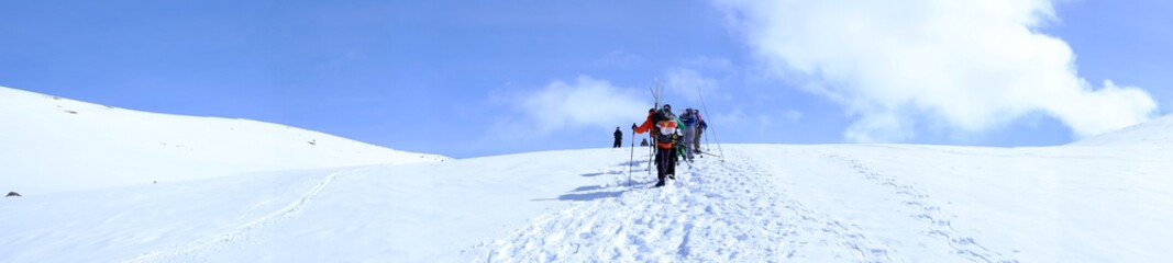 A group of tourists on a snowy mountain