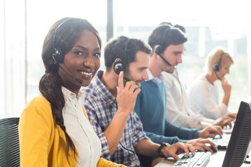 Team working on computer with headset