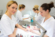 © Production Perig - Young attractive beautician students practising during courses