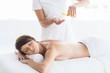 © WavebreakMediaMicro - Midsection of masseur giving massage to woman