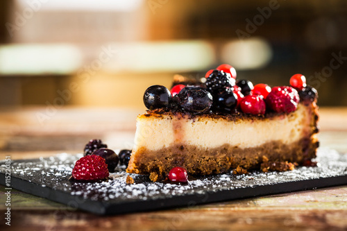 Fotografering  Cheesecake with berries